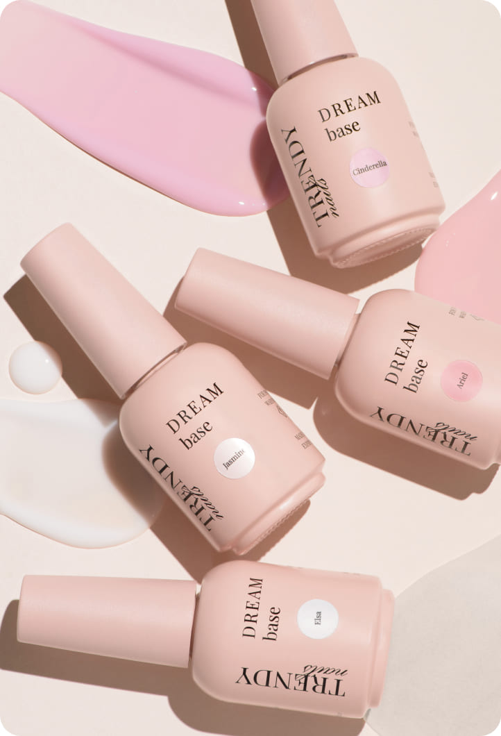 Trendy Nails DREAM base bottles in soft pink tones with labels, accompanied by text promoting new products