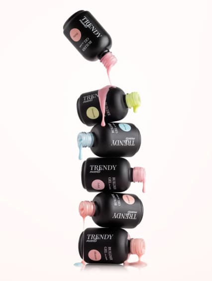 Stacked Trendy Nails bottles with dripping polish